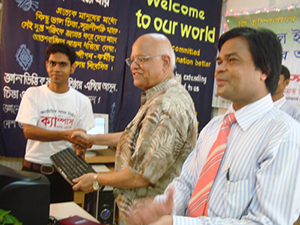 Finance Minister AMA Muhith handed over Computers to the Awardee of Digital Young Star Award as Chief Guest; Dr. M Helal is presiding over. (2010)